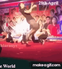a man is doing a trick on a stage with the date 29th april