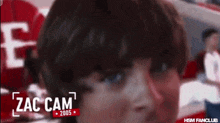 a close up of a person with the name zac cam on the bottom