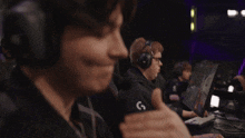 a man wearing headphones with the letter e on it