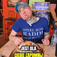 a man in a blue shirt that says steel rod radim