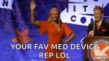 a woman in a red dress is standing in front of a man at a podium with the words your fav med device rep lol