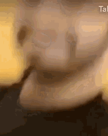a close up of a person 's face with the word talk in the upper right corner