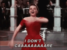a woman in a red dress says i don t caaaaaare
