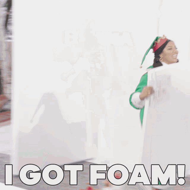 a woman in an elf costume holds a sign that says i got foam