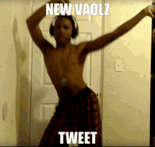 a shirtless man wearing headphones is dancing with the caption " new vaolz tweet " on the bottom