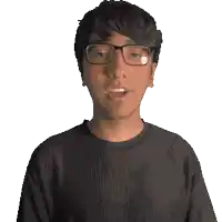 a man wearing glasses and a black shirt with the word maximo on it
