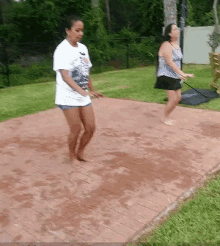 a woman in a nike shirt is walking barefoot