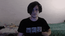a man wearing headphones and a athens greece t-shirt