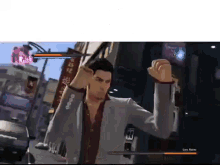 a man in a suit is playing a video game in a city .