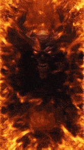 a devil with horns and red eyes is surrounded by fire .