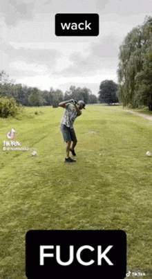 a man is swinging a golf club on a golf course with the word fuck below him
