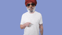 a man with a beard wearing a red hat and sunglasses is standing in front of a sign that says relax
