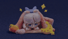 a cartoon character is laying under a blanket with a banana and carrots