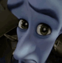 a close up of a cartoon character 's face with green eyes looking at the camera .