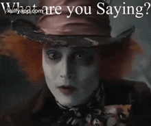 a picture of mad hatter from alice in wonderland covering his mouth with his hand