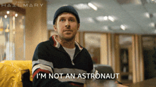 a man says i 'm not an astronaut in a movie poster