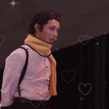 a man in a white shirt and yellow scarf is surrounded by hearts and stars