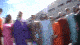 a blurry picture of a group of people standing in a line