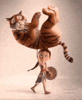 a girl is holding a tiger on her head