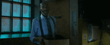 a man in a suit and tie is standing in a hallway with the words enjoy every single second