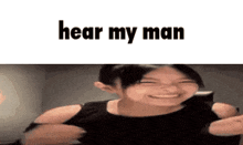 a girl is smiling with the words hear my man written above her