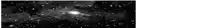 a black and white photo of a galaxy in the night sky