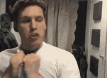a man wearing a white shirt and a black tie