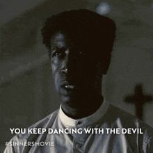 a black and white photo of a man with the caption you keep dancing with the devil #sinnersmovie