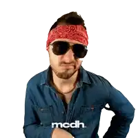 a man wearing sunglasses and a bandana with the word mcdh on the bottom right