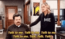 a woman is putting her hand on a man 's shoulder in a room .