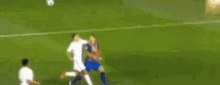 a blurry picture of a soccer game on a tv screen