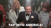 a man in a tuxedo is holding a glass of wine and the caption tap into america
