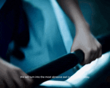 a blurred image of a person 's hands with the words " we will turn into the most abrasive awl in the world today "