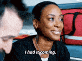 a woman says i had it coming in front of a red bag