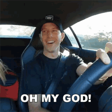 a man in a vans hat is driving a car with the words oh my god below him