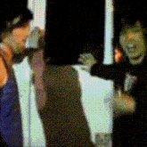 a blurry picture of a man and a woman talking