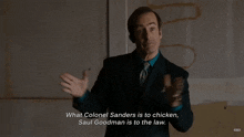 a man in a suit and tie says what colonel sanders is to chicken and saul goodman is to the law
