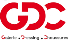 a red and white logo for gdc galerie dressing and chaussures