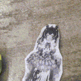 a drawing of a girl in a dress is on a table