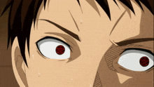 a close up of a person 's eyes with a red pentagram in the center