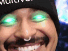 a close up of a person 's face with glowing green eyes and a hat that says " multiv " on it