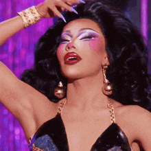 a close up of a drag queen 's face with makeup on