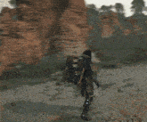 a video game character is standing in front of a person
