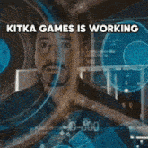 a picture of a machine with the words kitka games is working above it