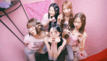 a group of girls are posing for a picture and one of them has a shirt that says ' i love you ' on it