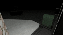 a black tank is sitting on a concrete floor