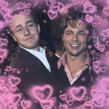 two men are standing next to each other with pink hearts surrounding them and the word swish is visible