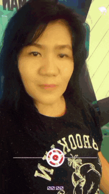 a woman wearing a shirt that says ' abercrombie ' on it