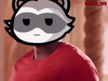a man wearing a red shirt with a raccoon head on his head .
