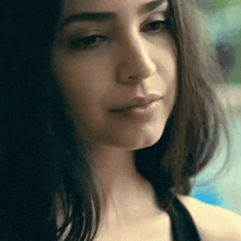 a close up of a woman 's face with her mouth open